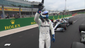 Mercedes-AMG's Valtteri Bottas salutes the fans after earing pole position.