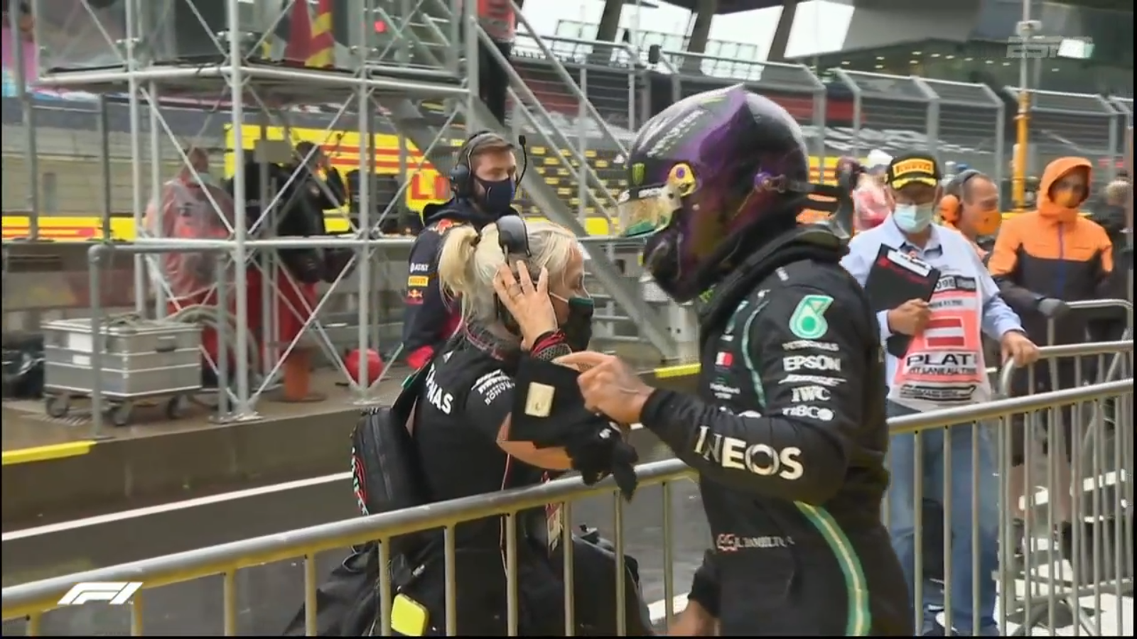 Lewis Hamilton (Mercedes) celebrates his amazing lap, on full wet tires, to secure Pole Position with his trainer Angela Cullen.