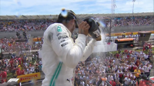 Hamilton shares the victory champagne with the fans.